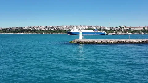 Kadikoy Lighthouse and Cargo Ship in Istanbul Turkey 動画素材 335469812