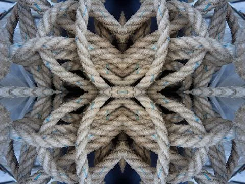 A kaleidoscope abstract pattern made of overlapping and knotted rope, cord, n Stock Photos