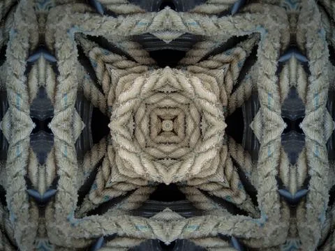 A kaleidoscope abstract pattern made of overlapping and knotted rope, cord, n Stock Photos