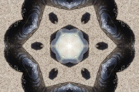 Kaleidoscope pattern of seashells, mussels creating abstract beach art Stock Photos