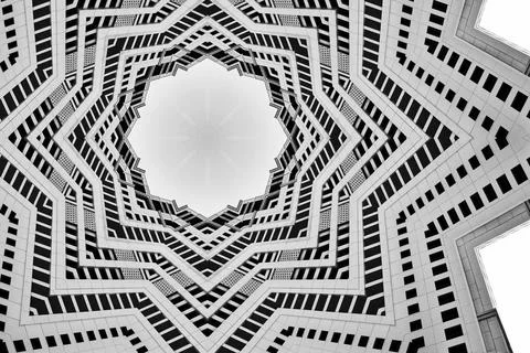 Kaleidoscope pattern with symmetric polygon layers in gray and black Stock Illustration