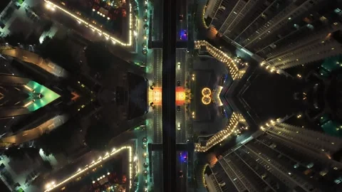 Kaleidoscopic aerial mirror effect of metropolis at night with illuminated build Stock Footage 335249338