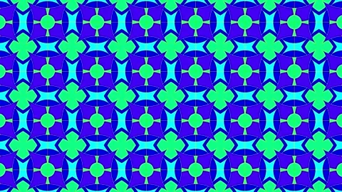 Kaleidoscopic pattern in bright colors creates visual interest on a blue ba.. Stock Footage 332846632