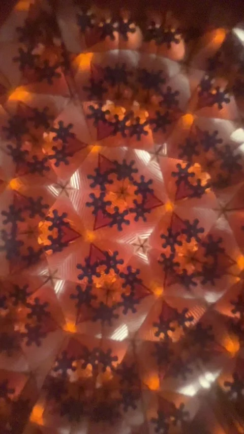 Kaleidoscopic pattern changing with blue snowflakes and orange background Видео 341854274