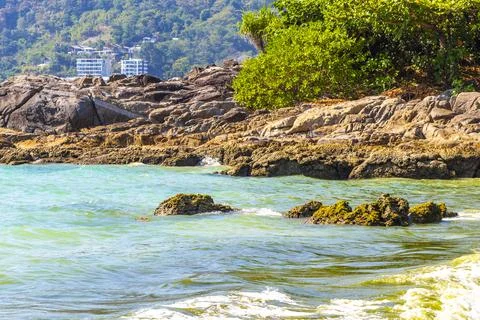 Kalim Beach Phuket dramatic waves rocks tropical ocean panorama scenery. Stock Photos