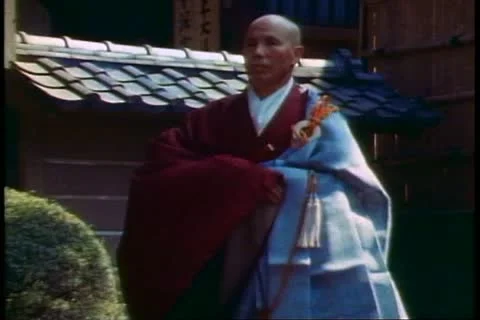 KAMAKURA, JAPAN, 1982, Two Shinto priests pass in a ceremony at Kamakura Stock Footage 10844553