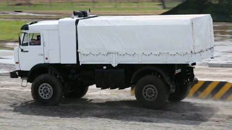 KAMAZ-43501 jumps from springboard during demonstration program Stockbeeldmateriaal 35233245
