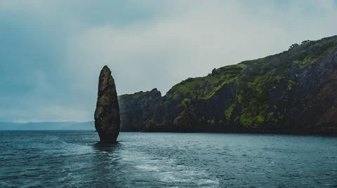 Kamchatka. The rock Devil's finger. Sentry. Avacha Bay. Stock Photos