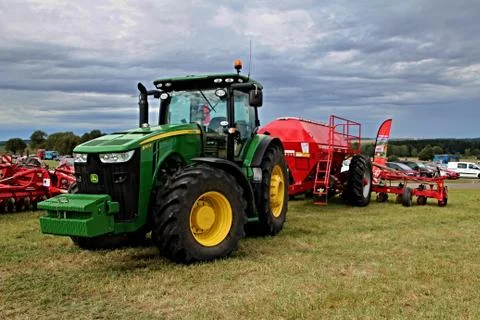 KAMEN, CZECH REPUBLIC - September 10, 2013: John Deere tractor with attache.. Stock Photos