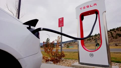 Kamloop, Canada, Dec 2020: Branded charging station for electric vehicles Tesla Stock Footage 145550456