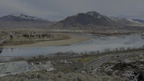 Kamloops B.C. view of Mt Paul, Thompson river and bridge, 4k pan Stock Footage 229902540