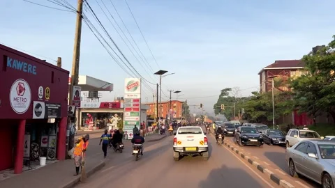 Kampala mixed traffic corridor with boda boda flow and informal transport Stock Footage 334592605