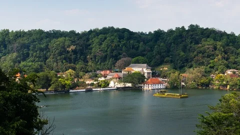 Kandy lake and temple view in Sri Lanka motion time lapse Stock Footage 106469486