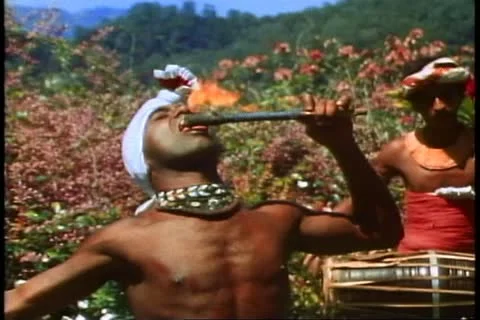 KANDY, SRI LANKA, 1982, The fire eater, a young man eats the flame Stock Footage 10845883