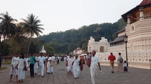Kandy, Sri Lanka - April 24, 2019: Visitors and worshipers in Temple of the S Stock Footage 106932773