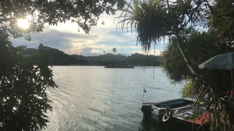 Kandy, Sri Lanka, the sun through the clouds on the lake Video stock 132840570