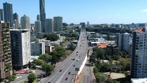 Kangaroo Point, Brisbane CBD, Queensland: Footage of Skyline, River, Jacarandas Stock Footage 305200180