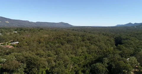 Kangaroo river crossed by Hampden bridge in Kangaroo valley near local town. Stock Footage 135878735