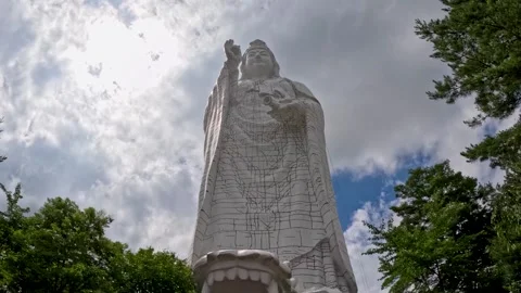 Kannon statue looking up from below Stock Footage 249311003