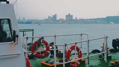Kaohsiung Harbor Series - Ship Deck View with Life Rings and Misty City Video stock 330995426