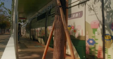 Kaohsiung Light Rail Transit Train Pulling Into Stop In Hot Summer Stock Footage 230915705