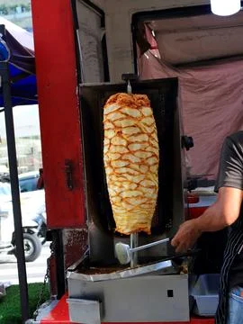 Kapab machine grilling chicken. Stock Photos