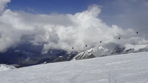 Kaprun, modern cable cabin in alps are moving in the mountains, winter skiing se Stock Footage 305994924