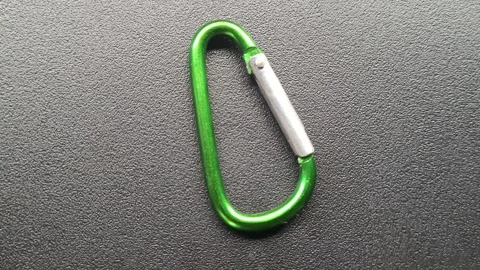 Karabiner rotates in front of camera Stock Footage 245000867