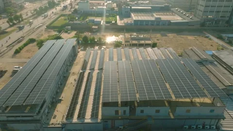 Karachi, Pakistan. Rooftop solar panel system array near busy road. Descending Stock Footage 336811227