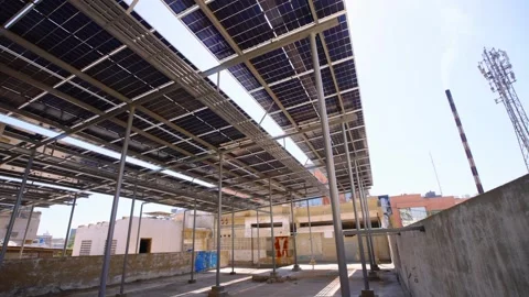 Karachi, Pakistan. Rooftop solar panel array. Underneath, left pan clip. Stock-Footage 336839796