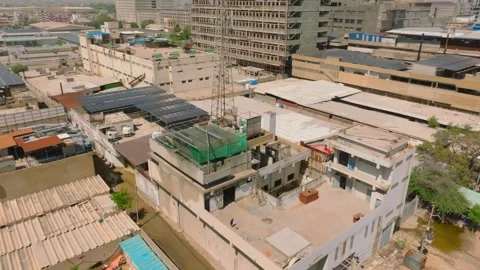 Karachi, Pakistan. Solar panel array over factory rooftop. Industrial district Stock-Footage 336811165