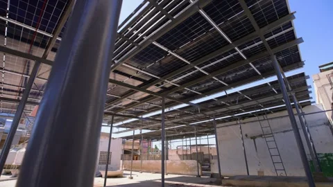Karachi, Pakistan. Underside rooftop solar panel array support. Stock Footage 336839787
