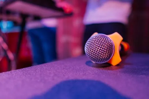 A karaoke microphone is lying on the table Stock Photos