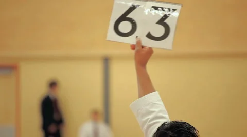 Karate judges giving a performance score Stock Footage 4958700