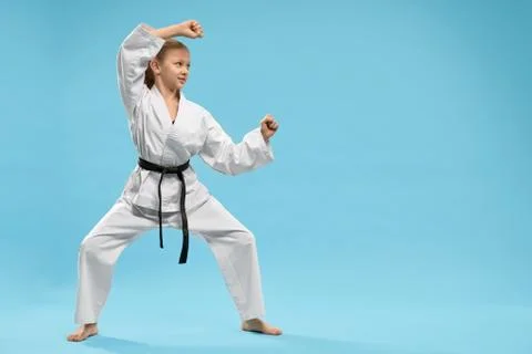 Karate junior in defense position, training. Stock Photos