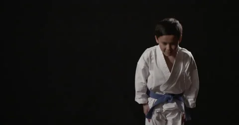 Karate kid 10 year old bows 50fps Video stock 48622607
