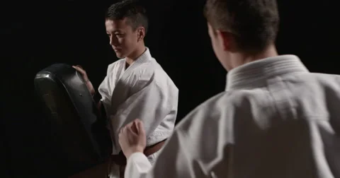 Karate kid kicking on bag focus pull Video stock 50397723