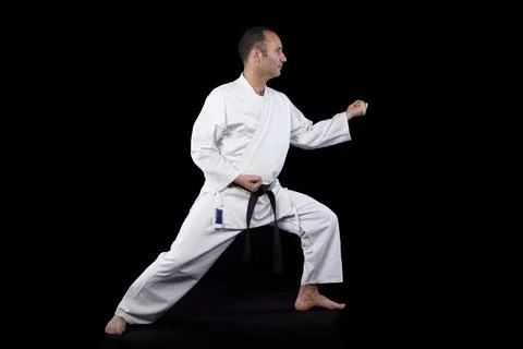 Karate man with back background Stock Photos
