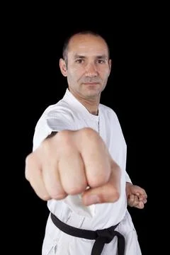 Karate man with back background Stock Photos