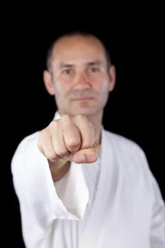 Karate man with back background Stock Photos