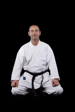 Karate man with back background Stock Photos