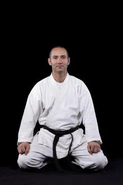 Karate man with back background Stock Photos