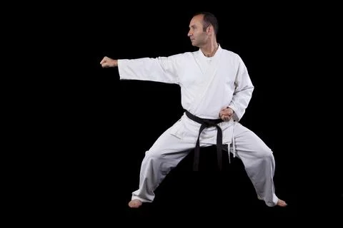 Karate man with back background Stock Photos
