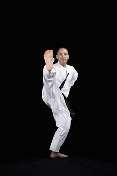 Karate man with back background Fotos de archivo