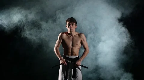 Karate man with a naked torso exercise w... | Stock Video | Pond5