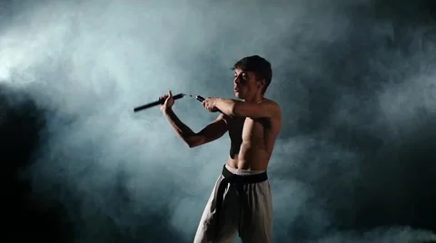 Karate man with a naked torso exercise w... | Stock Video | Pond5