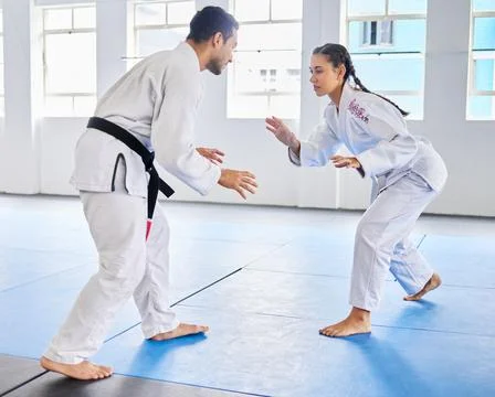 Karate, martial arts and man and woman fight, battle or practice fighting skill Stock Photos