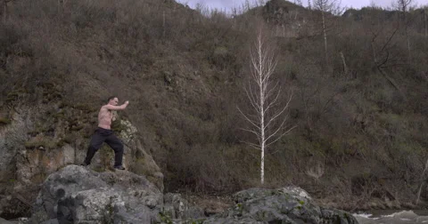 Karate in the mountains preparing for battle Stock Footage 63033887