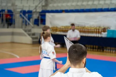 The karate referee shows marks during martial art competition. Stock Photos
