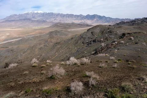 Karkas mountain range rises above desert in Isfahan province of Iran. Village of Stock Photos